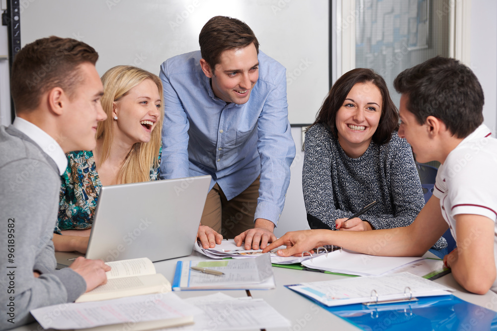 Teacher Working In Classroom With Students Teacher Working In Classroom With Students