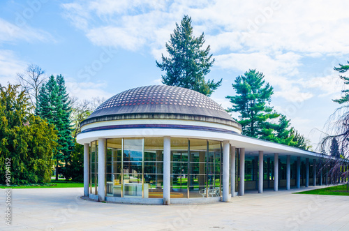 famous kolonada street in czech city podebrady connects train station with the center of city and it is decorated by beautiful park on one side and by historical spa buildings on the other. photo