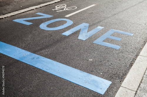 Road marking with zone, stop line and bicycle sign