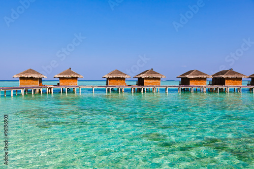 Bungalows on tropical Maldives island