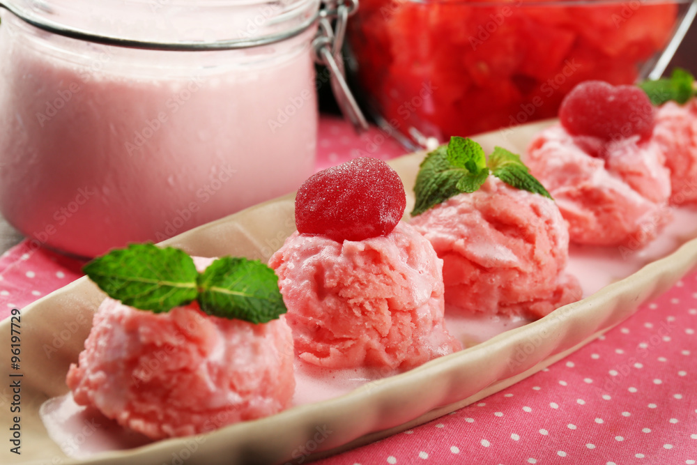 Watermelon ice cream in bowl on color wooden background Watermelon ice cream in bowl on color wooden background
