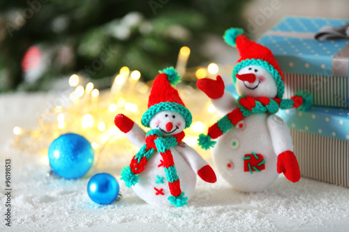 Cute snowmen on Christmas background © Africa Studio