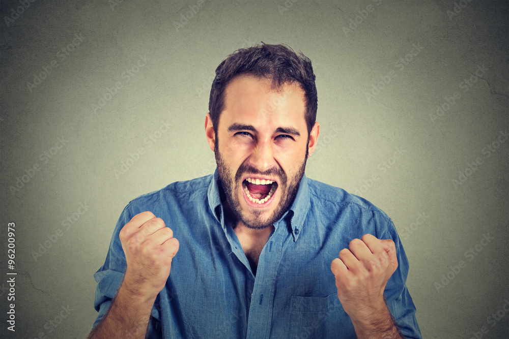 portrait of young angry man screaming portrait of young angry man screaming