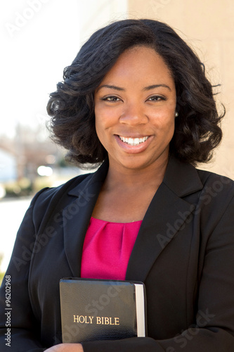 African American Woman holding a Bible 