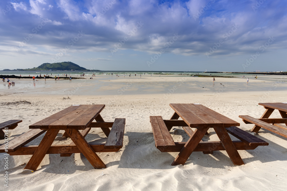 Empty wooden table on the beach, Jeju Island, South Korea
