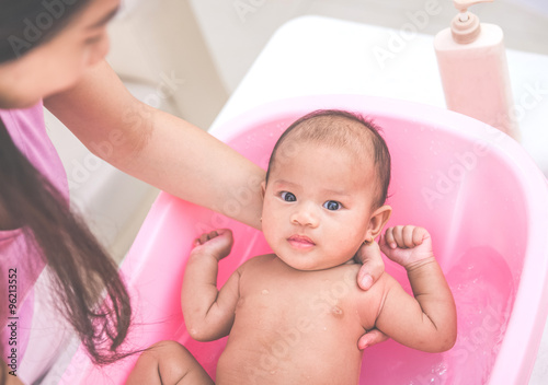 Cute baby on the bathing tub