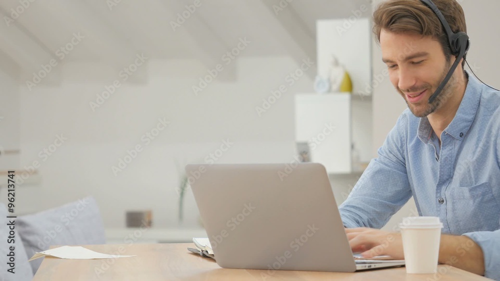 Man teleworking from home typing in laptop Man teleworking from home typing in laptop