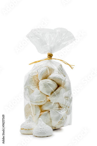Billede på lærred French white meringues in a cellophane bag, isolated on white background