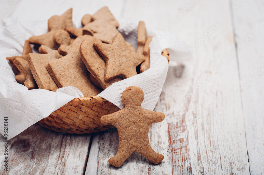 Christmas ginger cookies on wooden background