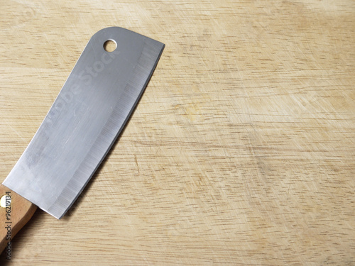 kitchen knife on wooden cutting board