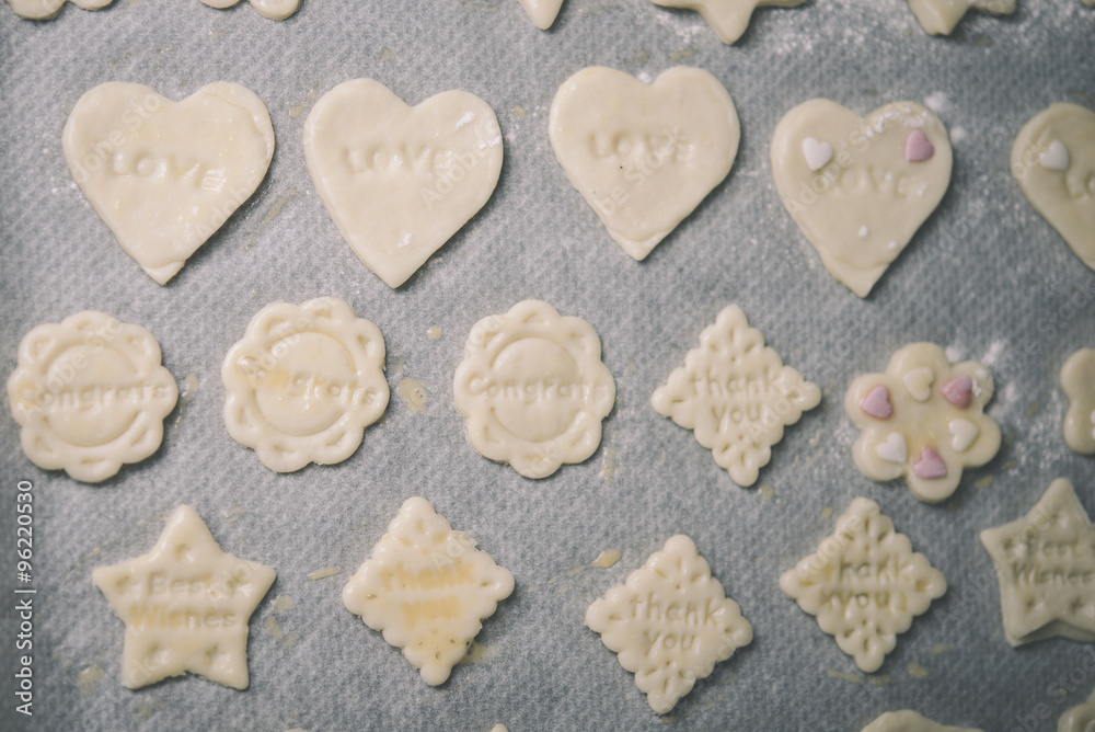 Obraz premium woman making ginger bread cookies in the kitchen