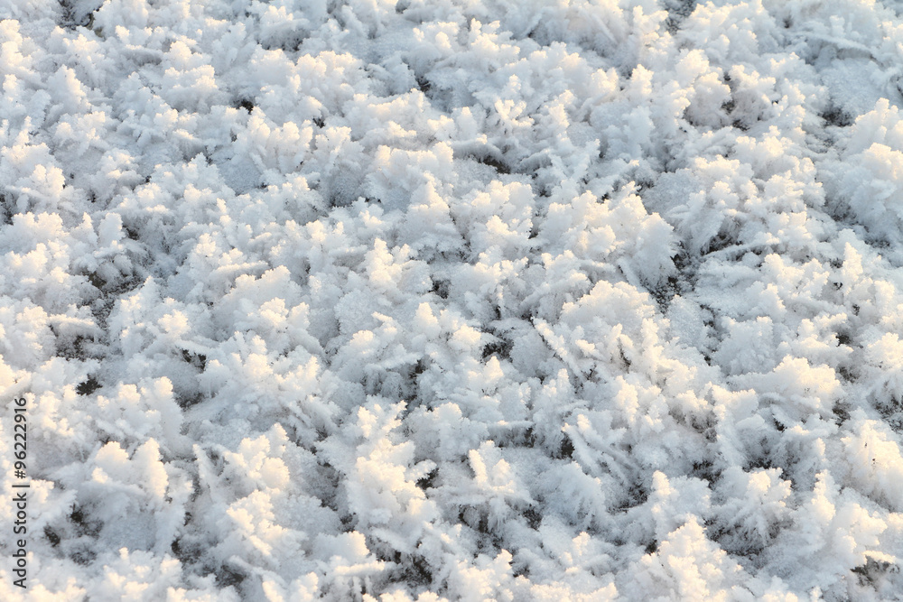 Natural snow background on an ice surface of the frozen river Natural snow background on an ice surface of the frozen river
