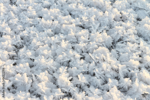 Natural snow background on an ice surface of the frozen river © Nataliia Makarova