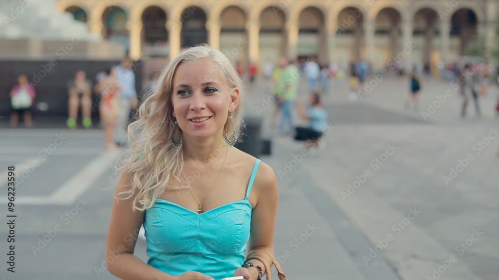 Woman posing while standing in the Duomo Square near horse statue in Milan Woman posing while standing in the Duomo Square near horse statue in Milan