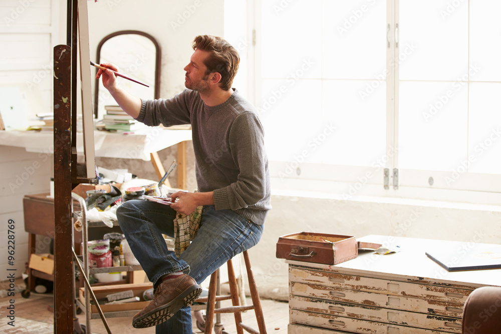 Fototapeta premium Male Artist Working On Painting In Studio