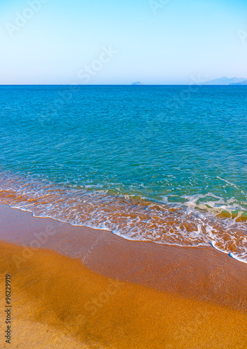 the beautiful long sandy beach at Chelona cape near Kardamaina village at Kos island in Greece photo