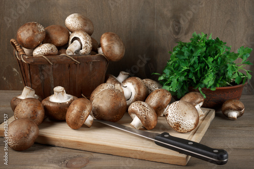 Still life with brown cap mushrooms and parsley