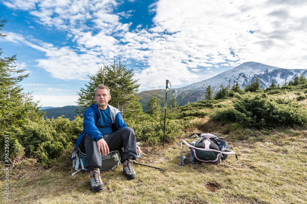 Fototapeta premium tired alpinist under mountain