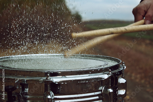 Photography Drum with water on it and splash after impact on it
