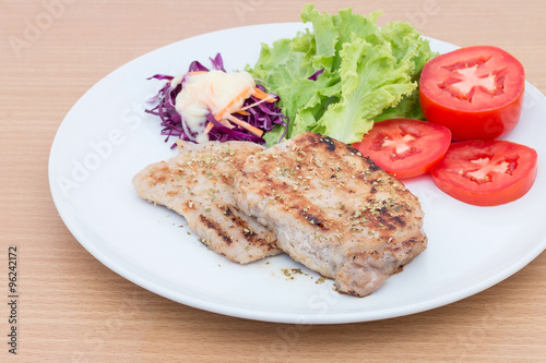 Grilled beef steak with salad  on wooden board