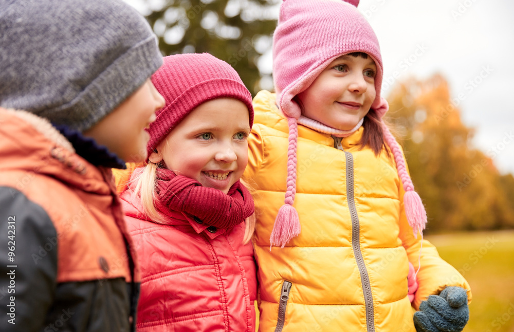 group of happy children hugging in autumn park group of happy children hugging in autumn park