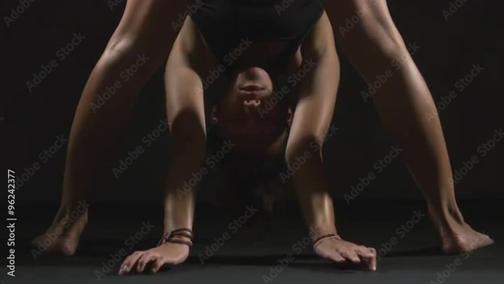 Active Asian gymnast woman stretching body close up Active Asian gymnast woman stretching body close up