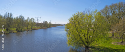 Fototapeta Naklejka Na Ścianę i Meble -  Sunny shores of a canal in spring 