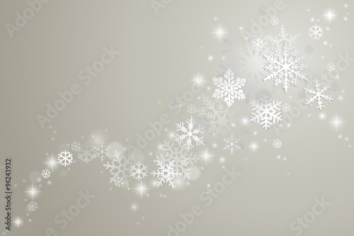 Winter background with swirl of snowflakes and snow on grey