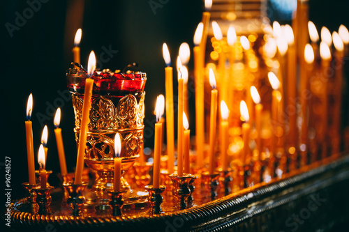 Church candles at dark background