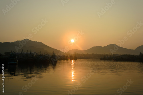 Sunrise and fishing boat at Khanom beach, Nakhon Si Thammarat, Thailand 