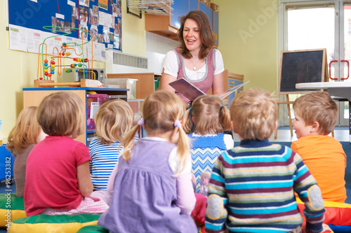 Canvastavla Group Of Pre School Children Listening To Teacher Reading Story