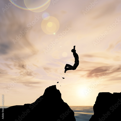 Human man silhouette jumping at sunset