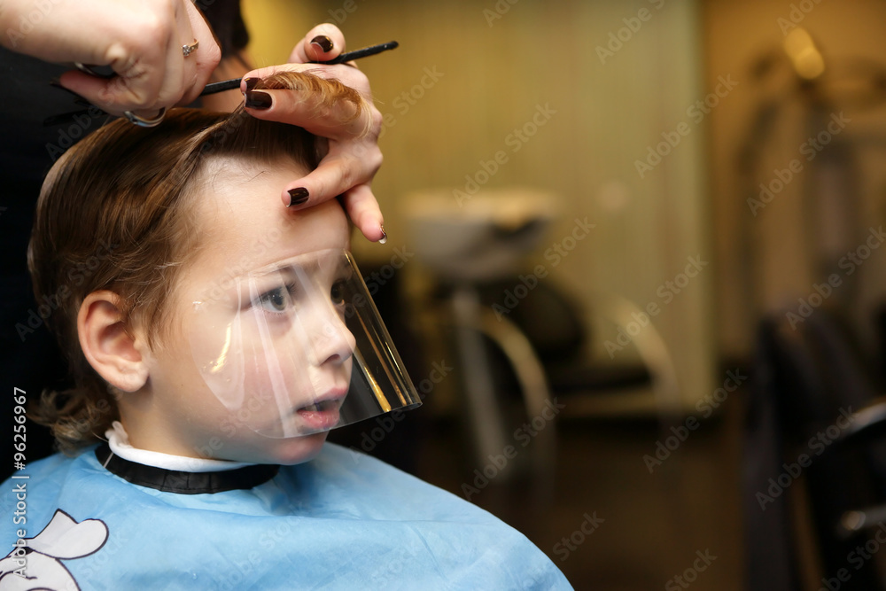 Thinking kid at the barbershop