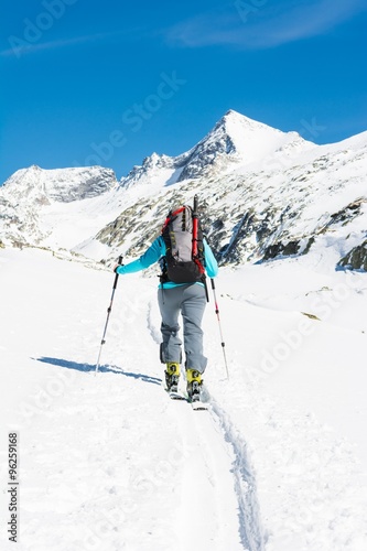 Ski touring in sunny weather.