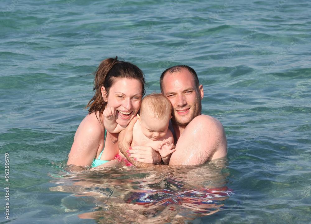 Family enjoying in the sea Family enjoying in the sea
