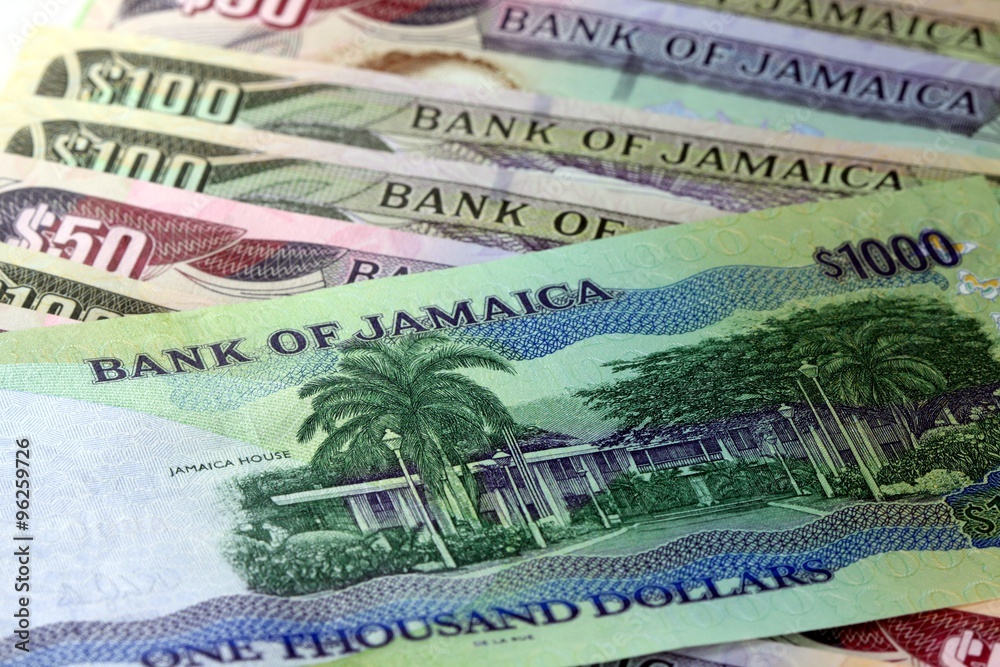 Fototapeta premium Assorted Jamaican money banknotes - Financial security concept background