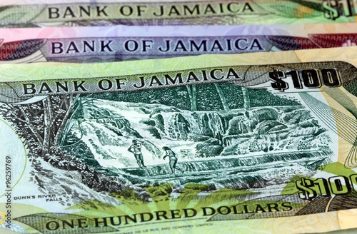 Assorted Jamaican money banknotes - Financial security concept background photo