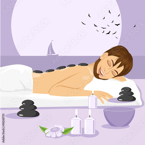 man having stone massage in a spa