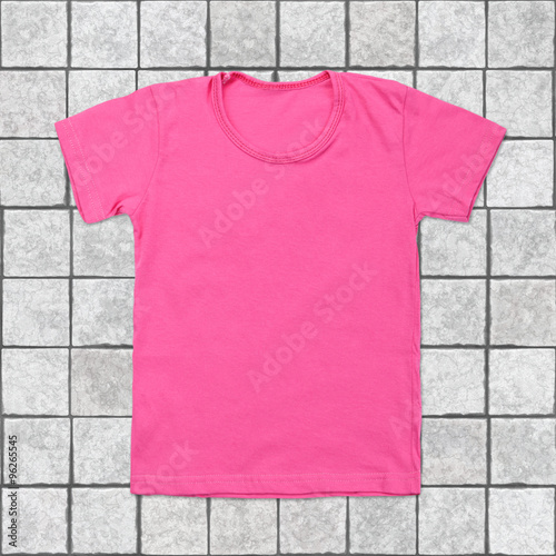 Pink blank t-shirt on tile background