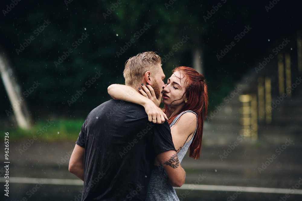 beautiful couple kissing in the rain beautiful couple kissing in the rain