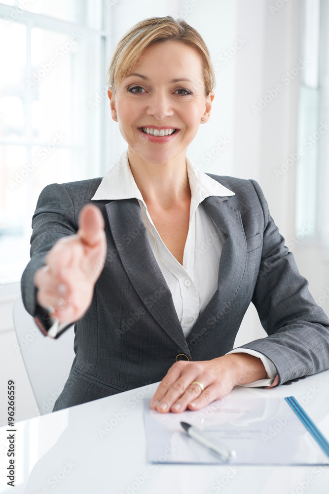 Female Businesswoman Extending Hand In Greeting Female Businesswoman Extending Hand In Greeting
