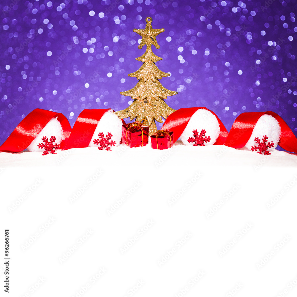 christmas ornament in snow on glitter background christmas ornament in snow on glitter background