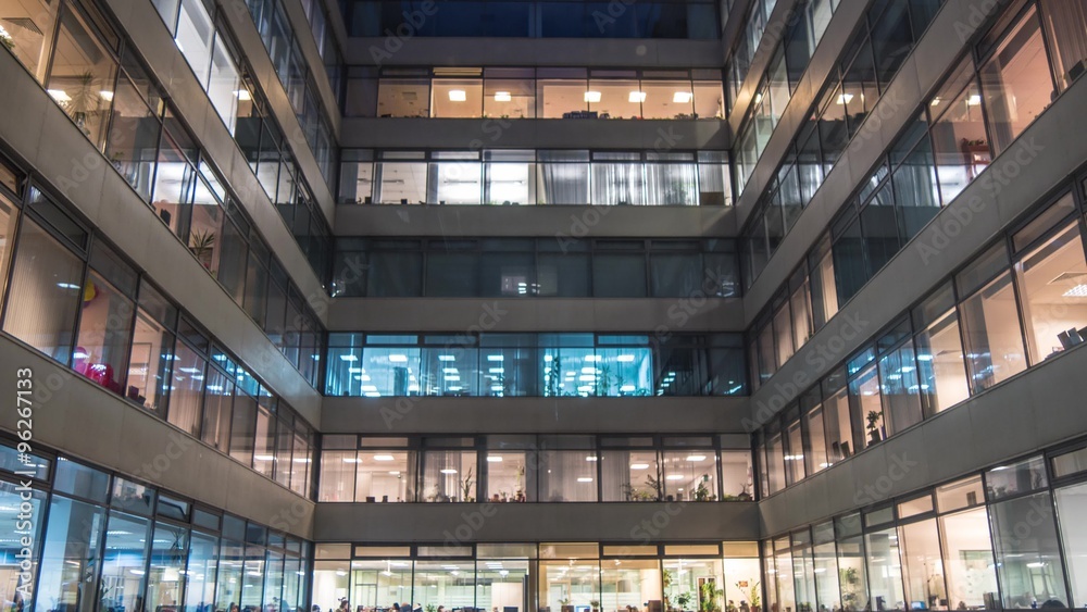 Time lapse of busy city office workers together in large modern office building Time lapse of busy city office workers together in large modern office building