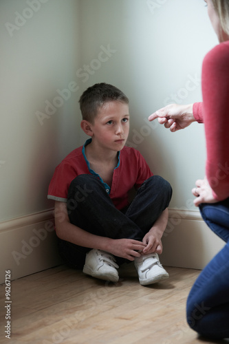 Mother Being Physically Abusive Towards Son At Home photo