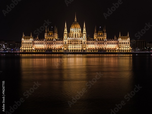 The parliament of Budapest reflecting in the Danube river at nig © shantihesse