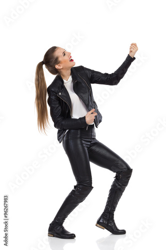 Woman Holding The Air Guitar