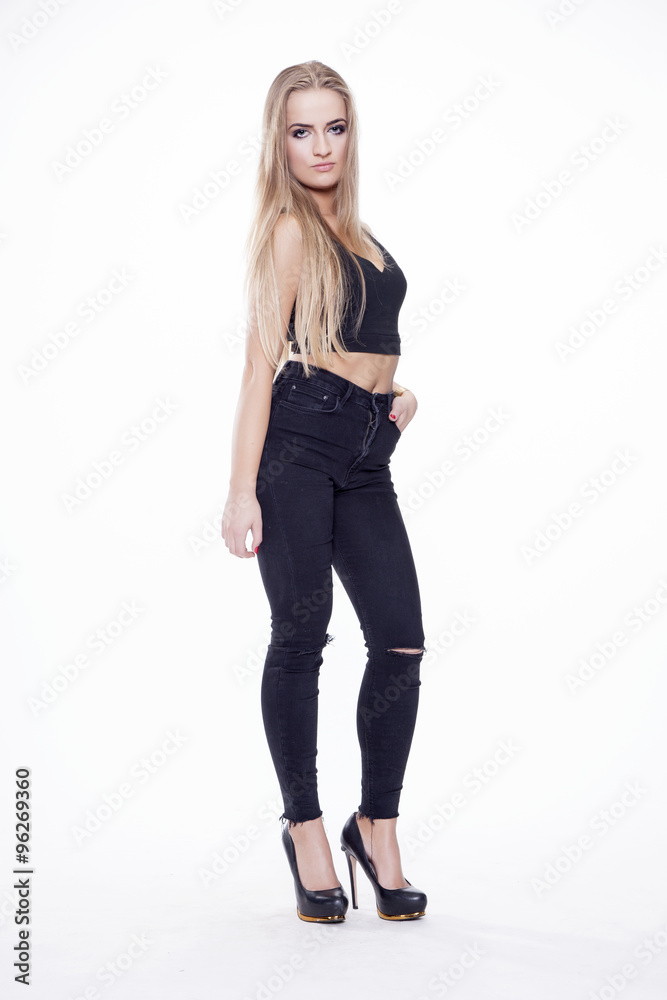 Young slim sexy woman in black dress isolated on white backgroun Young slim sexy woman in black dress isolated on white backgroun