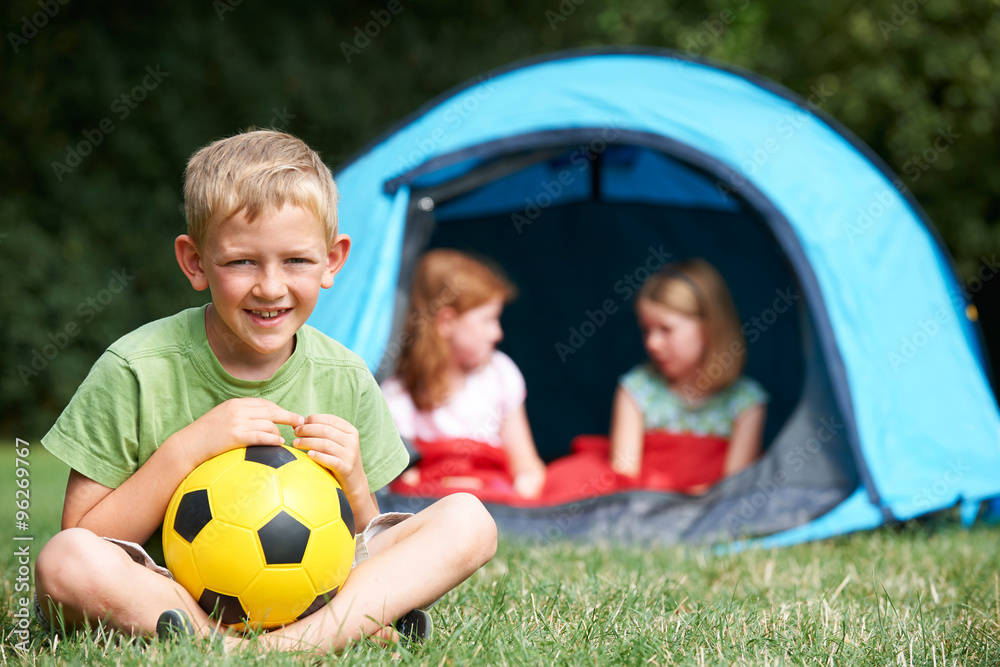 Portrait Of Boy With Friends On Camping Trip