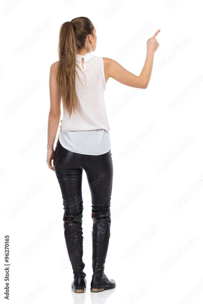 Rear View Of Pointing Woman