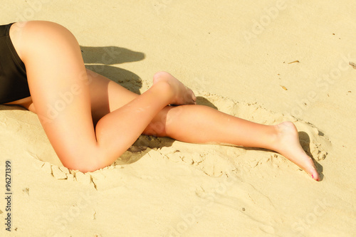 girl sunbathing tanning on the beach.